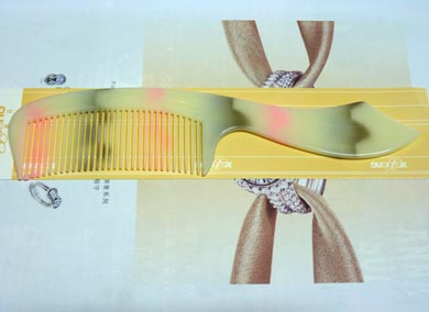 时尚刀把仿玉梳子